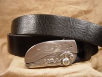 textured black leather belt with belt buckle knife