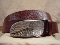 textured cognac leather belt with belt buckle knife
